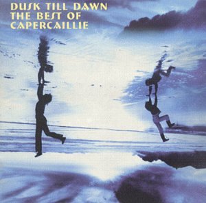 Album cover showing two figures reflected in water against a blue sky background.