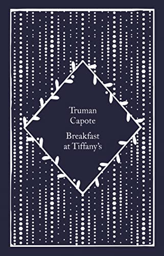 Dark blue book cover with white floral design and title text.