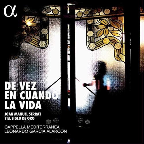 Silhouette of a person behind a decorative stained glass door with album text overlay.