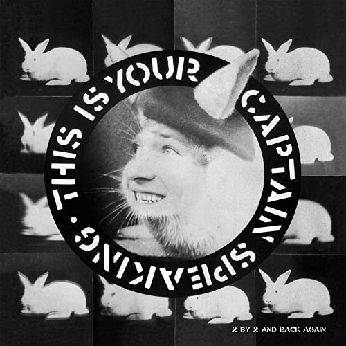 Black and white album cover featuring a man with rabbit ears surrounded by rabbits.