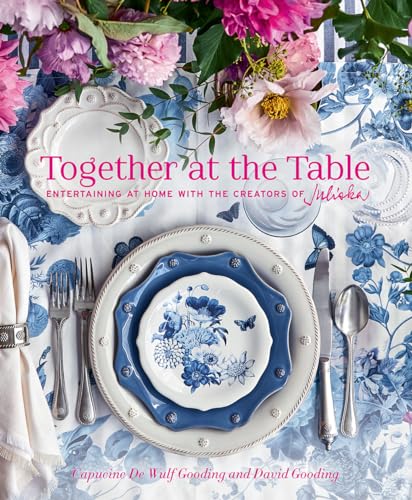 Book cover with floral arrangement and a beautifully set table.