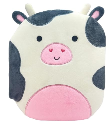 White and black spotted plush cow with pink nose and ears.