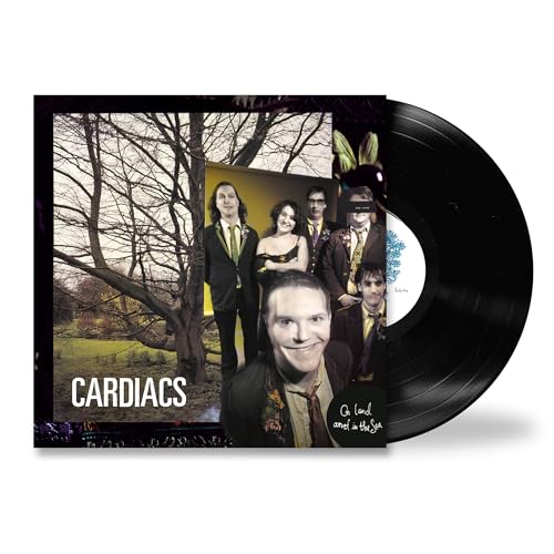 Vinyl record album cover featuring a band portrait in front of a bare tree.