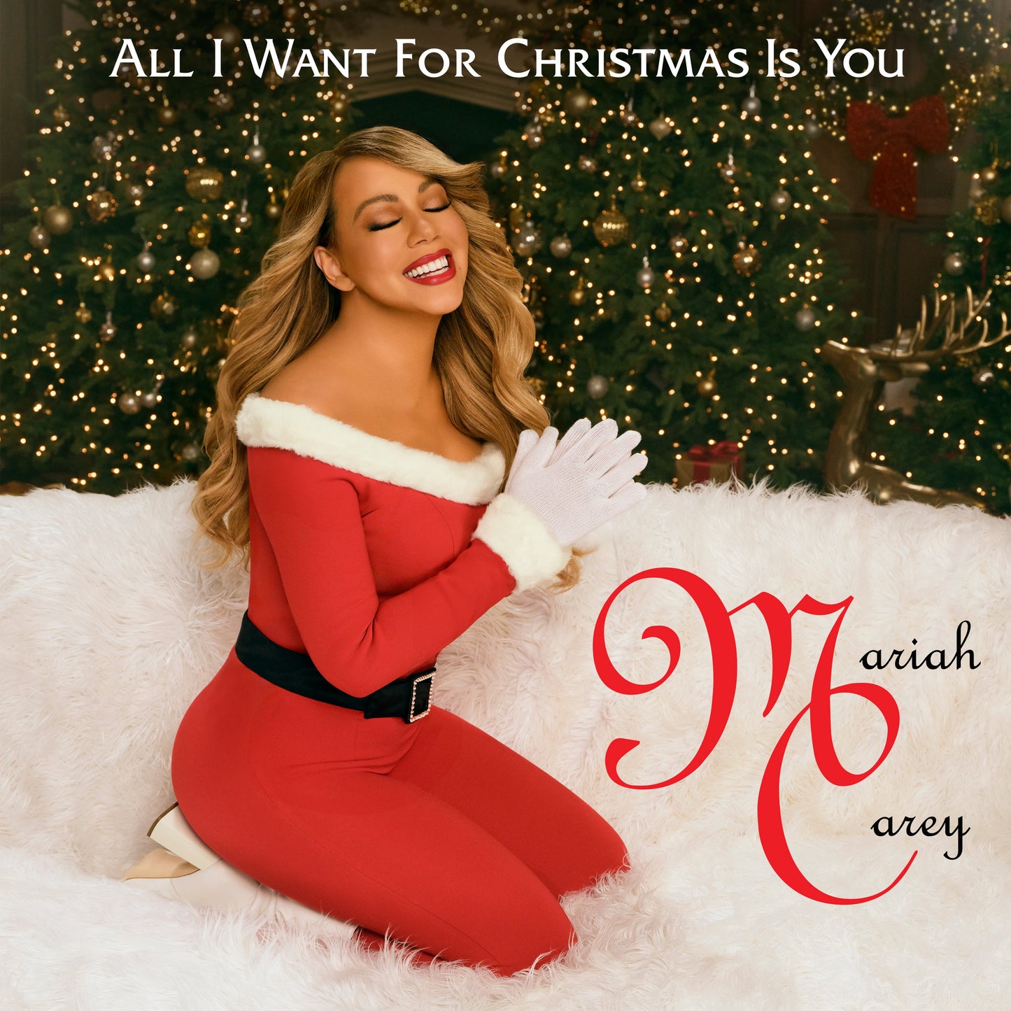 Mariah Carey on album cover with festive background and snowy fur.