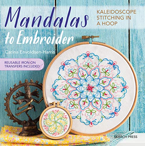 Embroidered mandala design in a wooden hoop, with book cover details.