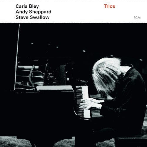 Black and white album cover featuring a pianist at a grand piano.