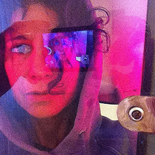 Close-up portrait of a woman with distorted, colorful light effects.