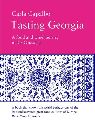 Book cover with pink top, blue patterned middle, and white bottom with text.