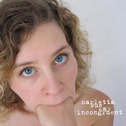 CD cover featuring a close-up portrait of a woman with curly hair.