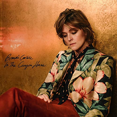 Brandi Carlile album cover, portrait of singer against textured gold background.