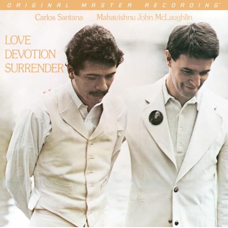 Album cover featuring Carlos Santana and John McLaughlin in suits.