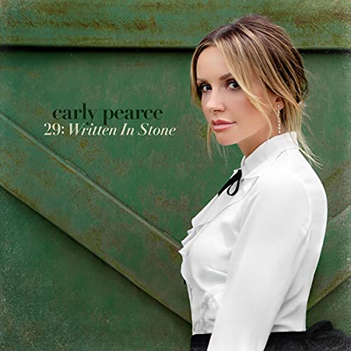 Carly Pearce album cover, "29: Written In Stone," featuring a portrait of the artist.