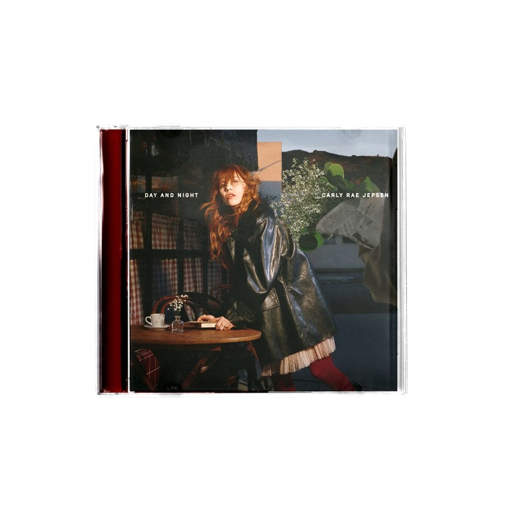 Carly Rae Jepsen CD cover featuring a woman in a leather jacket at a table.