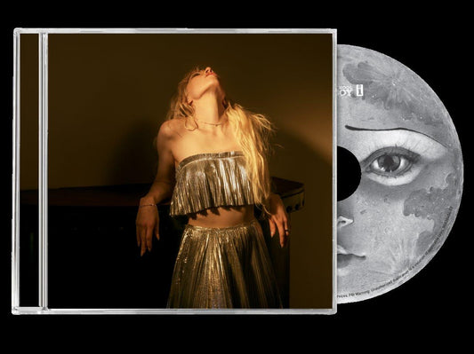 "CD case with Carly Rae Jepsen and a moon-themed disc."