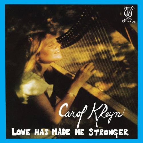 A woman plays a harp on the cover of Carol Kleyn's Love Has Made Me Stronger.