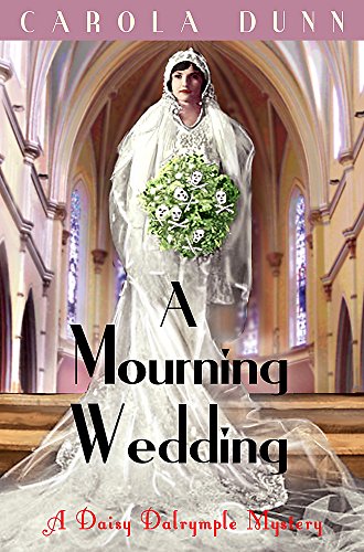 Bride in vintage wedding dress stands in a church interior.