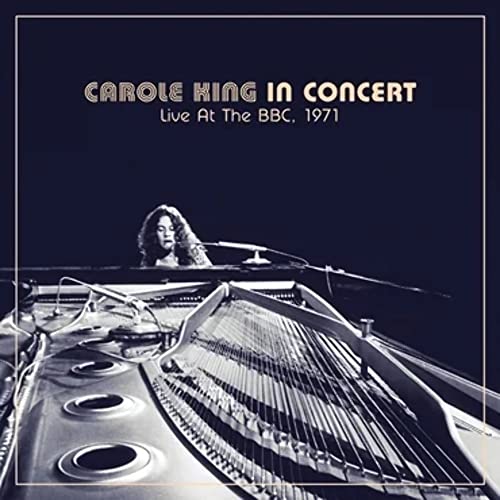 Carole King at a piano, album cover for “In Concert” vinyl record.