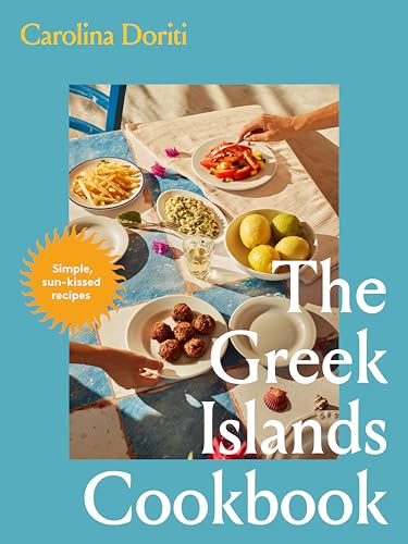 Cookbook cover showing a table with plates of Mediterranean food on a blue background.
