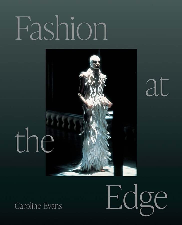 Book cover featuring a model in a white, fringed garment and headpiece.