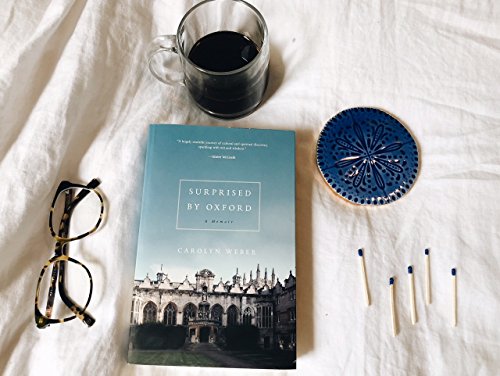 Book cover, “Surprised by Oxford,” with coffee, glasses, and matches.