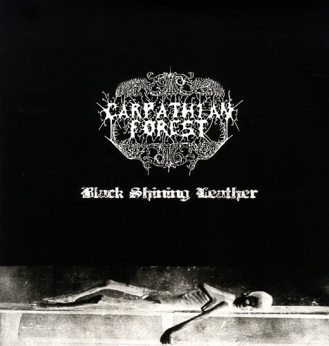 "Black vinyl album cover with white text and a skeleton on a stone slab."