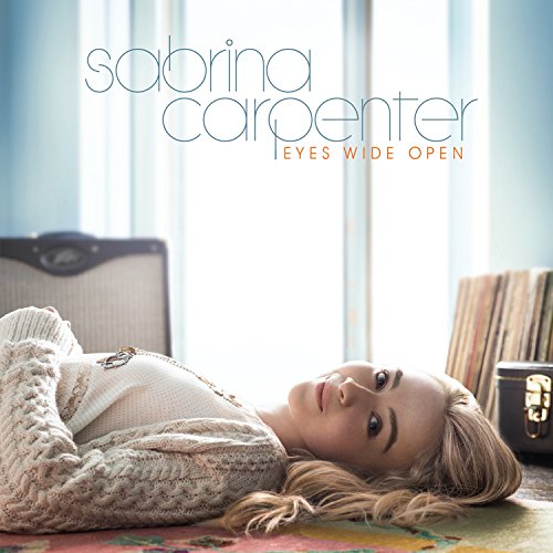 Sabrina Carpenter album cover, "Eyes Wide Open," with a relaxed pose.