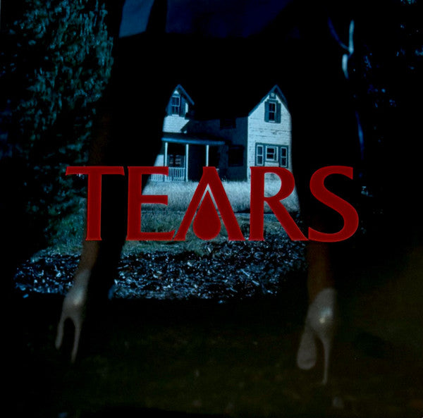 A house at night with the word TEARS in large red letters overlaying it.