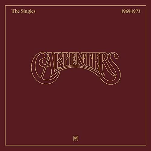 Carpenters’ “The Singles 1969-1973” vinyl album cover, maroon background.