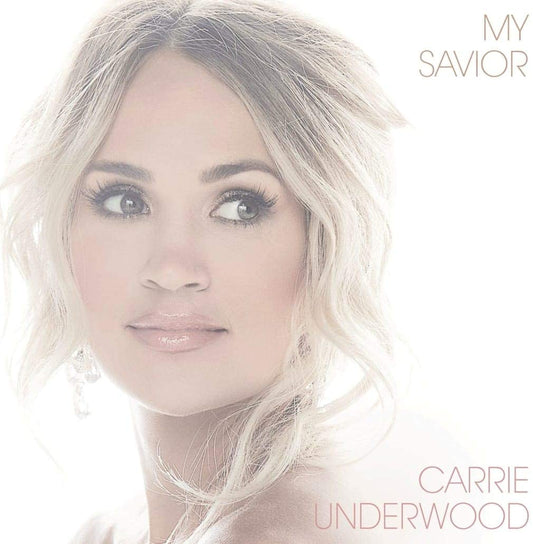 Carrie Underwood's album cover, "My Savior", featuring a blonde woman against a white background.