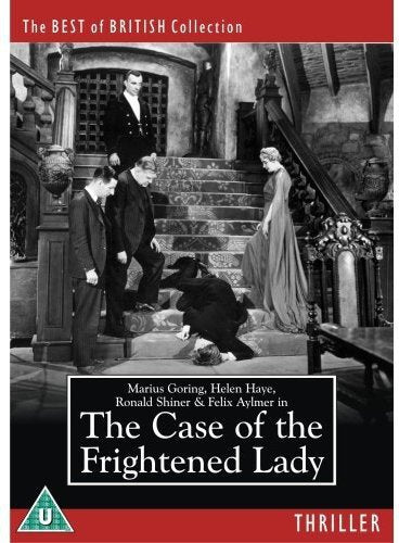 Black and white film scene showing people standing on stairs near a fallen man.