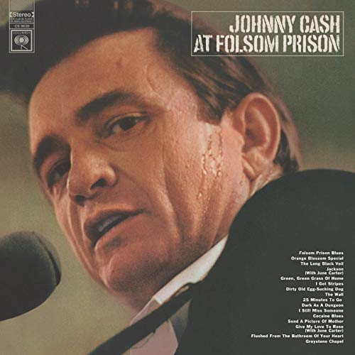 Johnny Cash album cover, "At Folsom Prison," featuring a portrait of Cash.