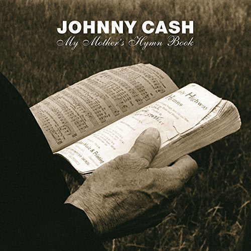 Open hymn book held in weathered hands, sepia toned album cover.