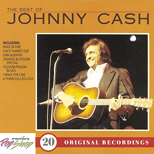 CD cover featuring Johnny Cash playing guitar on stage.