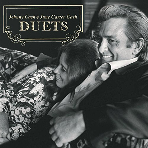 Johnny Cash and June Carter Cash embrace on the “Duets” album cover.