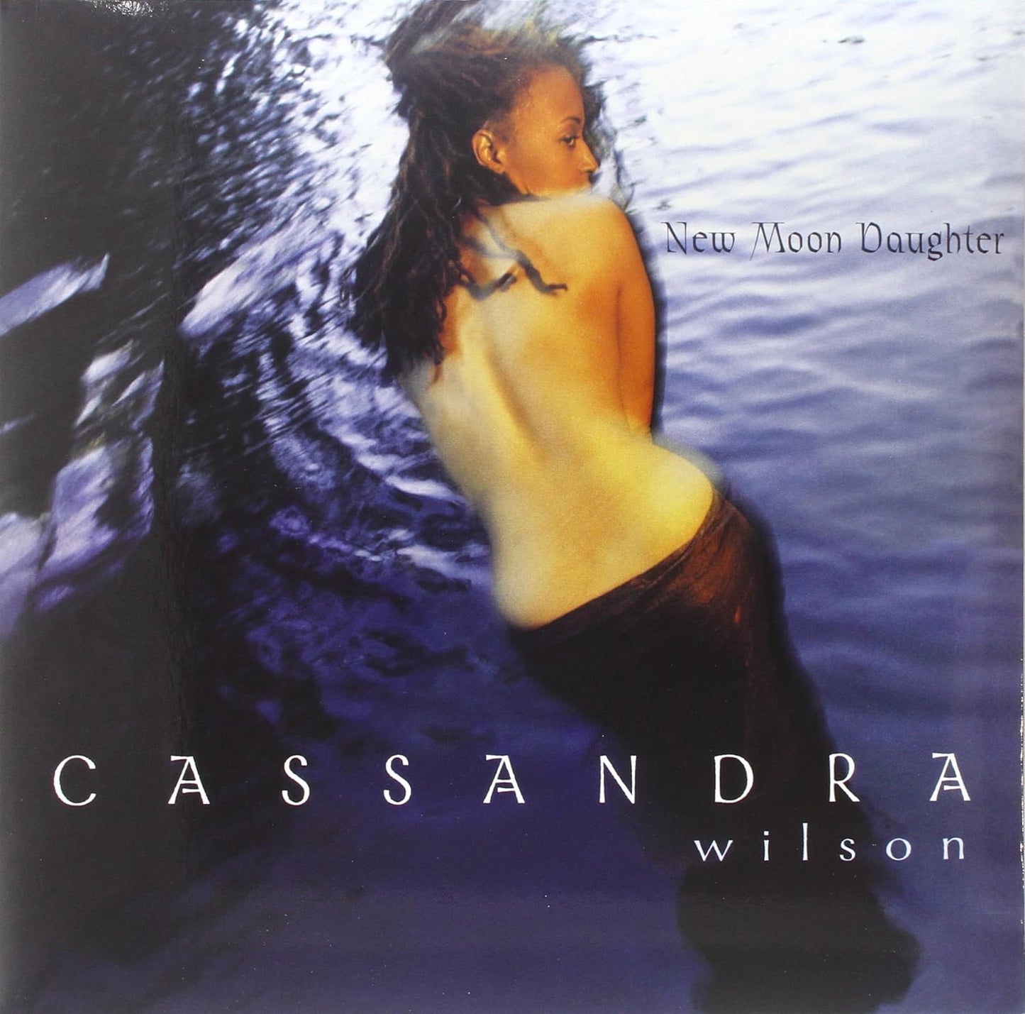 Album cover for Cassandra Wilson’s “New Moon Daughter” featuring a woman’s portrait.