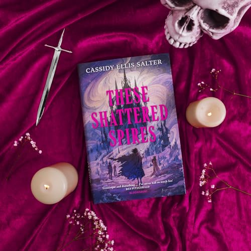 Book cover with gothic imagery, surrounded by candles, a skull, and a sword.