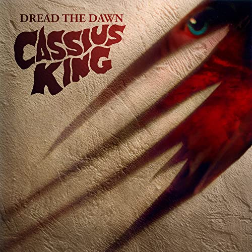 CD cover for Cassius King’s “Dread The Dawn” with a shadowed hand.