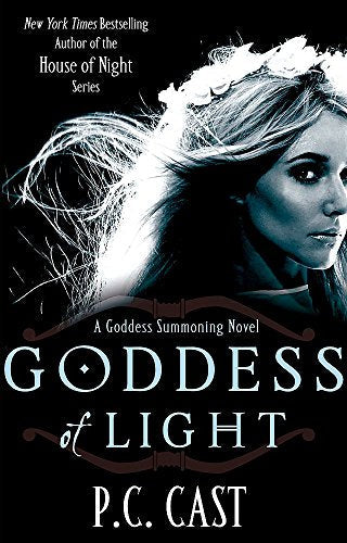 Book cover: woman with long hair, glowing light, dark background.
