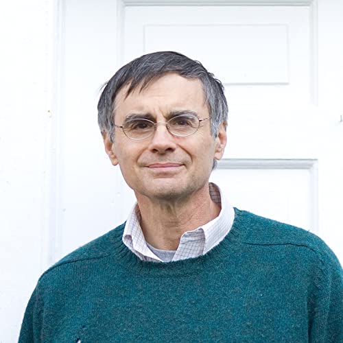 Portrait of a middle-aged man with short grey hair and glasses.