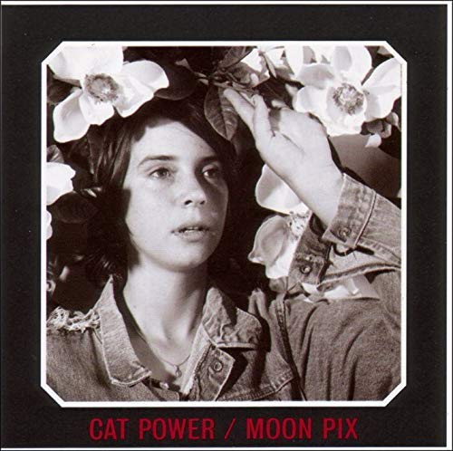 Cat Power album cover: woman with white flowers, black and white photo.