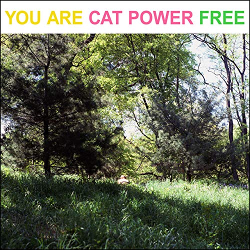 Cat Power album cover: a lush green forest with a figure in the grass.