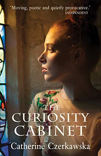 Book cover: young woman’s profile with title “The Curiosity Cabinet.”