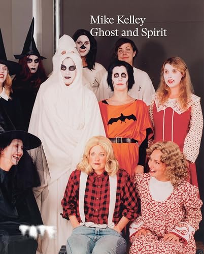 Group portrait of people in Halloween costumes, book cover for Mike Kelley.