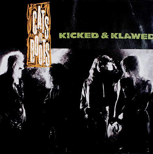 "Album cover with band members in black and white, band name and title."