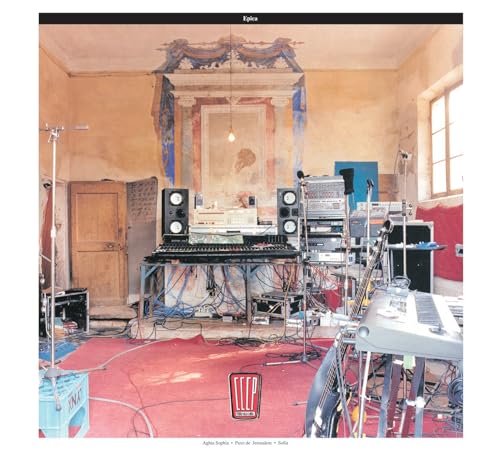 CD cover: room with ornate wall, electronic music equipment, and red carpet.