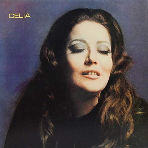 Album cover featuring a woman with long, dark hair and closed eyes against a dark background.