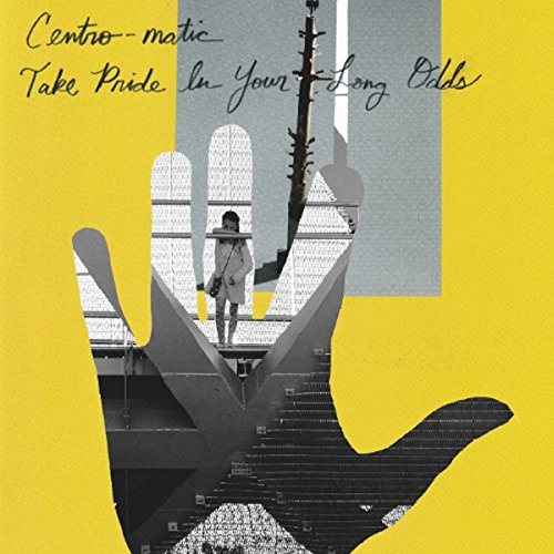Album cover with a hand holding a person on a building, yellow background.
