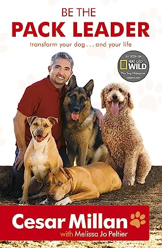 Book cover featuring Cesar Millan with three dogs of different breeds.