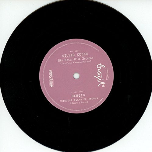 Black vinyl record with a pink label, white text, on a white background.