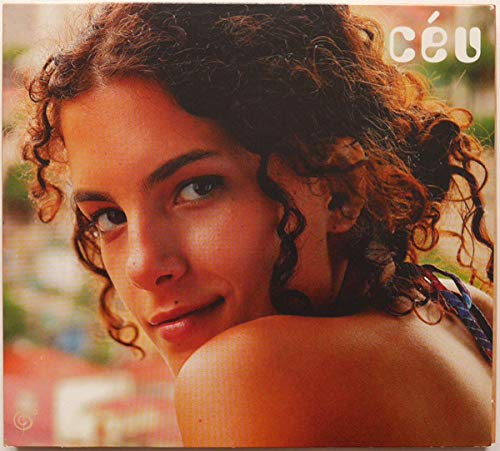 CD cover featuring a close-up portrait of a woman with curly hair.